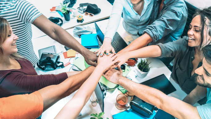 groups of employees with hands together